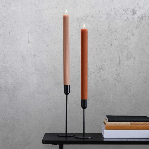 Two elegant 27cm ribbed dinner candles in warm tonal copper colors, perfect for festive dining and table settings.
