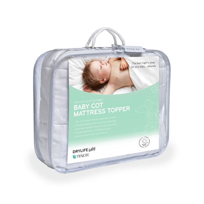 Soft, breathable cot mattress topper for babies, featuring hypoallergenic fabric and secure fitted design for comfortable sleep.