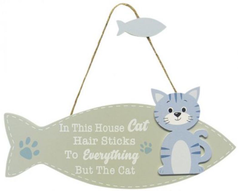 Wooden fish-shaped cat hanger sign, stylishly organizing pet grooming tools while adding nautical decor charm.