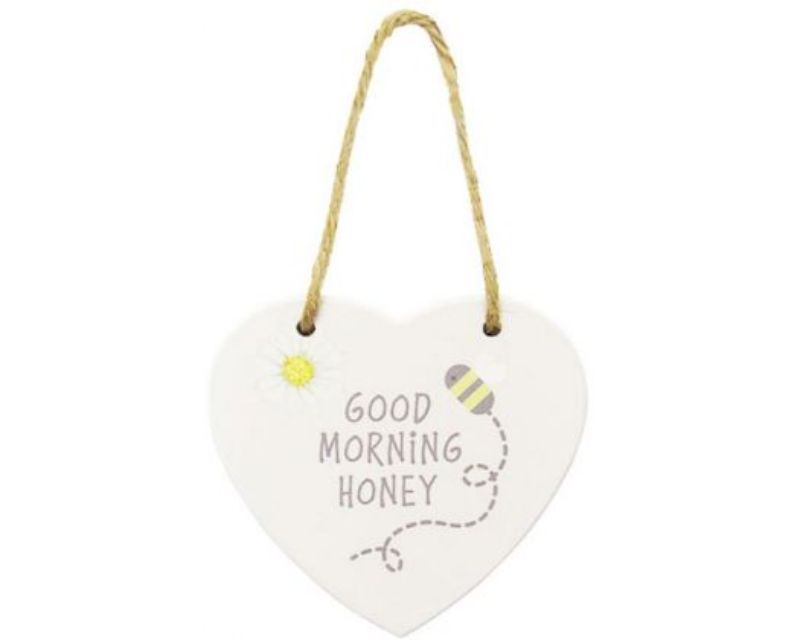Heart-shaped wooden sign with rustic twine hanger celebrating bees, perfect for home decor or gifts.