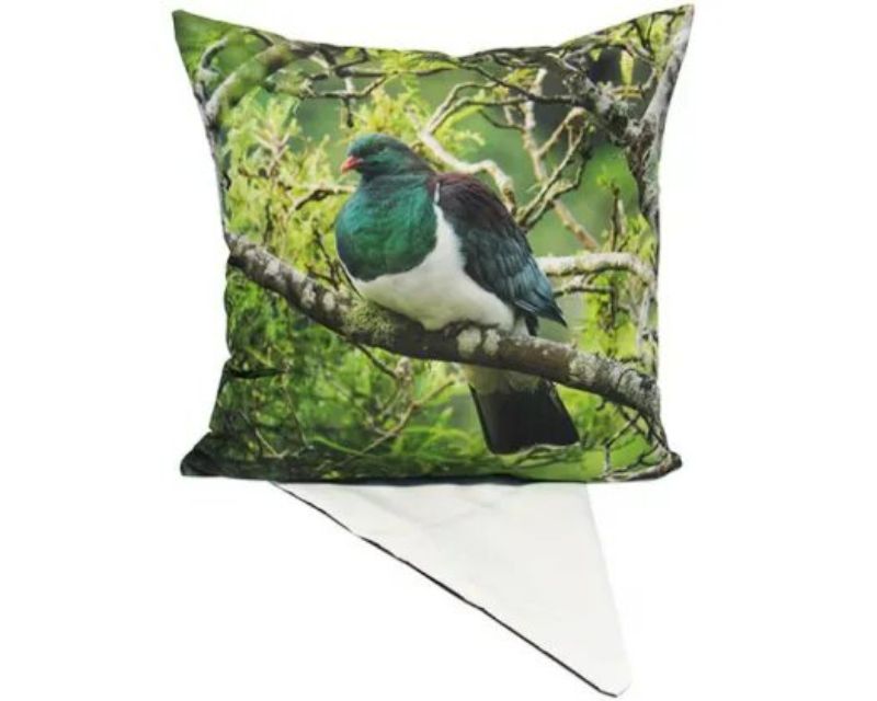 Decorative cushion cover featuring a vibrant Kereru design, perfect for enhancing any living space.