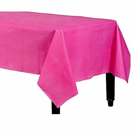 Rectangle bright pink plastic tablecover, 137cm x 274cm, perfect for parties and easy cleanup, adding vibrant color to events.
