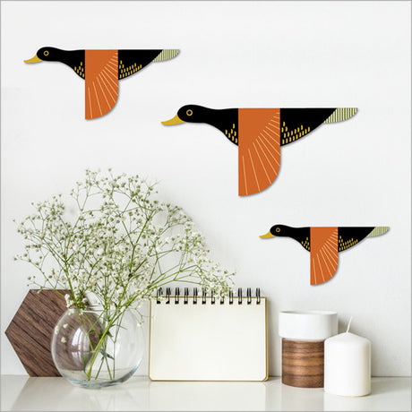 Set of 3 printed wall art pieces featuring charming Folk Duck designs on brushed silver ACM for elegant decor.