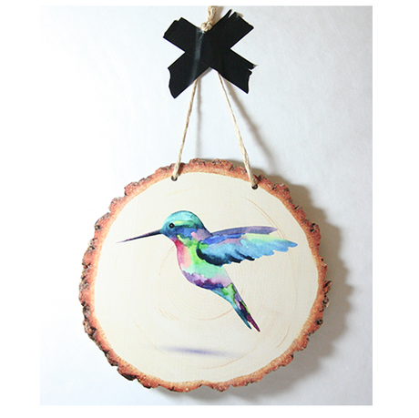 Vibrant hummingbird design on eco-friendly pine veneer wood slice wall art, perfect for nature-themed decor.
