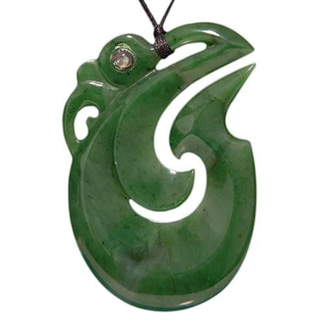 Jade Manaia Hook Pendant: A unique nephrite jade piece symbolizing protection, suspended on an adjustable black wax cord.