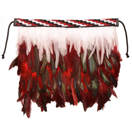 Handcrafted red korowai christening cloak with vibrant feathers and Poutama pattern, symbolizing love and cultural heritage.