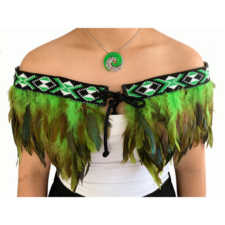 Elegant Korowai Cape Green featuring a traditional kowhaiwhai pattern, ideal for special occasions and cultural expression.