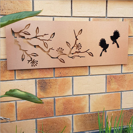 Large copper and black wall art featuring pohutukawa and fantail, perfect for enhancing indoor or outdoor spaces.