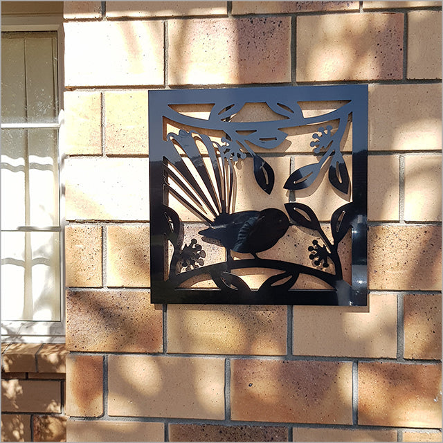 Large square wall art featuring a stylized Fantail on black ACM, celebrating Kiwiana aesthetics for indoor or outdoor use.