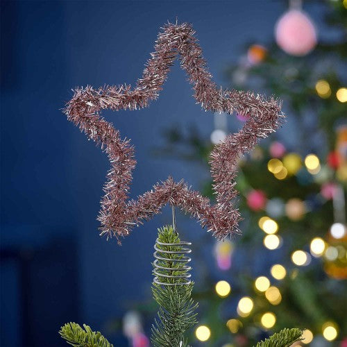 Vibrant pink tinsel star tree topper, 20cm x 20cm, perfect for adding sparkle to any Christmas tree decor.