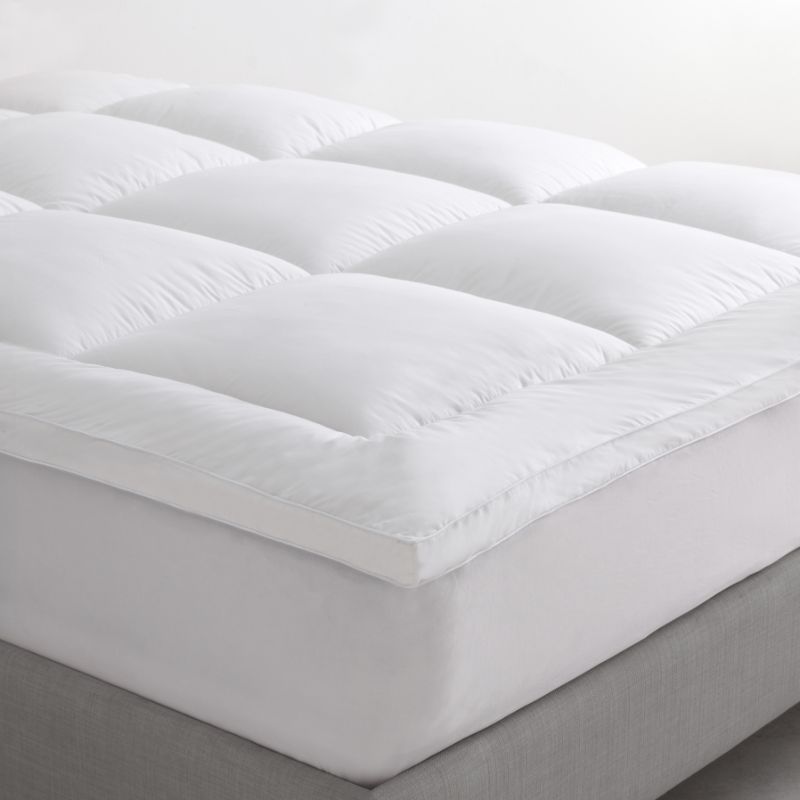 Logan & Mason Pillowtop Mattress Topper with plush microfibre fill and breathable cotton cover for enhanced queen bed comfort.