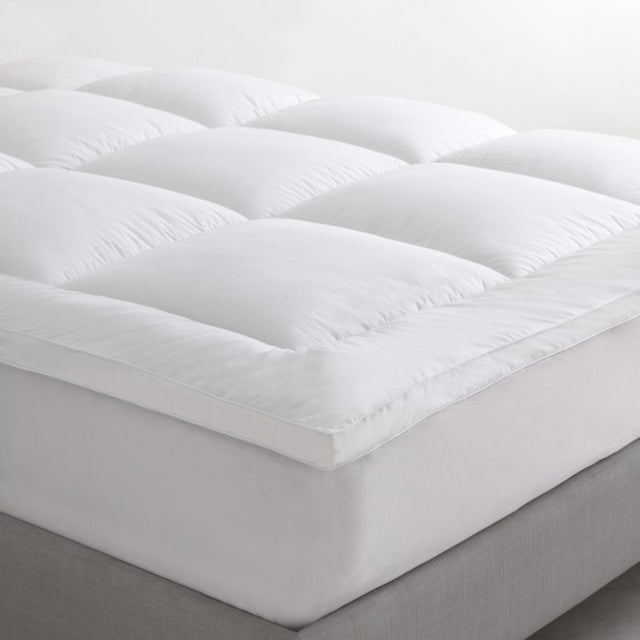 Logan & Mason Pillowtop Mattress Topper with plush microfibre fill and breathable cotton cover for enhanced queen bed comfort.