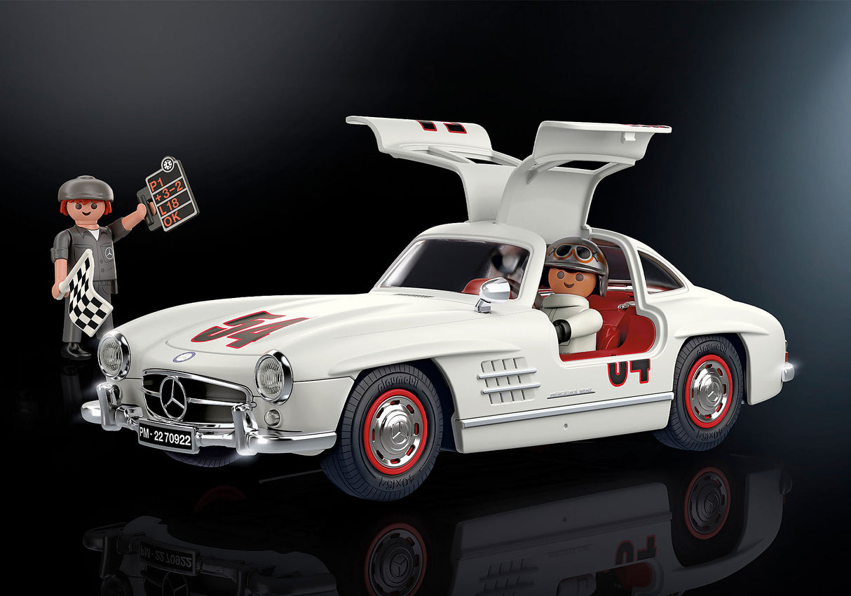 Playmobil Mercedes-Benz 300 SL model featuring gullwing doors, detailed cockpit, and included racecar driver and mechanic figures.