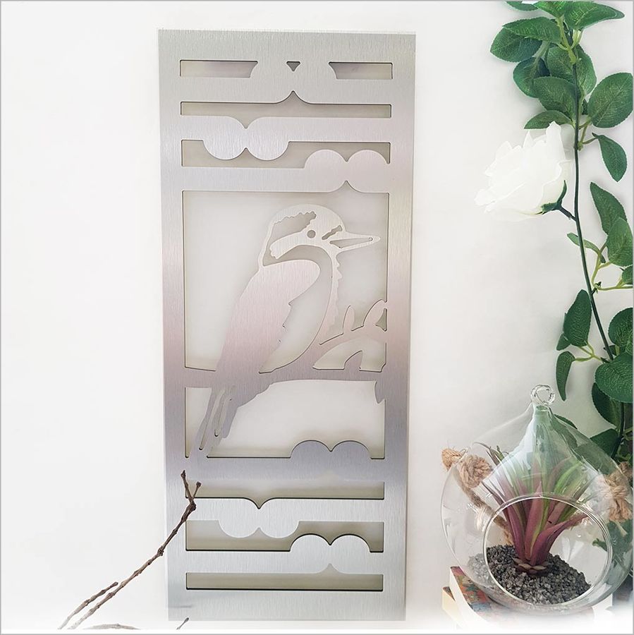 Kiwiana Wall Art featuring a Kingfisher and Koru design in brushed silver, suitable for indoor and outdoor display.
