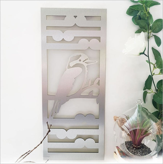 Kiwiana Wall Art featuring a Kingfisher and Koru design in brushed silver, suitable for indoor and outdoor display.