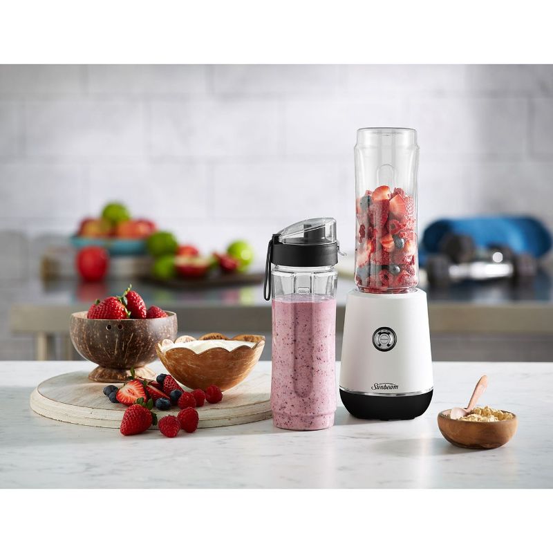 Sunbeam Insta Go Blender in white with two BPA-free sport bottles, ideal for smoothies and on-the-go nutrition.