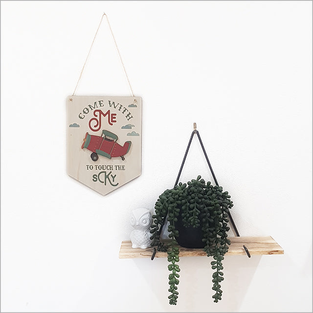 Eco-friendly wall art featuring a printed pine plane flag, perfect for aviation lovers and rustic decor.