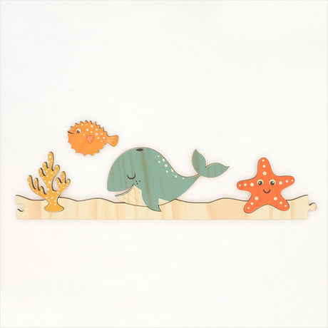 Under The Sea jigsaw wall art in eco-friendly pine, featuring marine life, ideal for children's rooms or play areas.