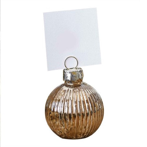 Elegant gold ribbed glass bauble place card holders for dining, perfect for weddings and dinner parties.