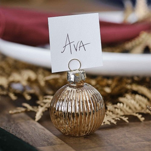Elegant gold ribbed glass bauble place card holders, set of four, perfect for upscale dining and events.