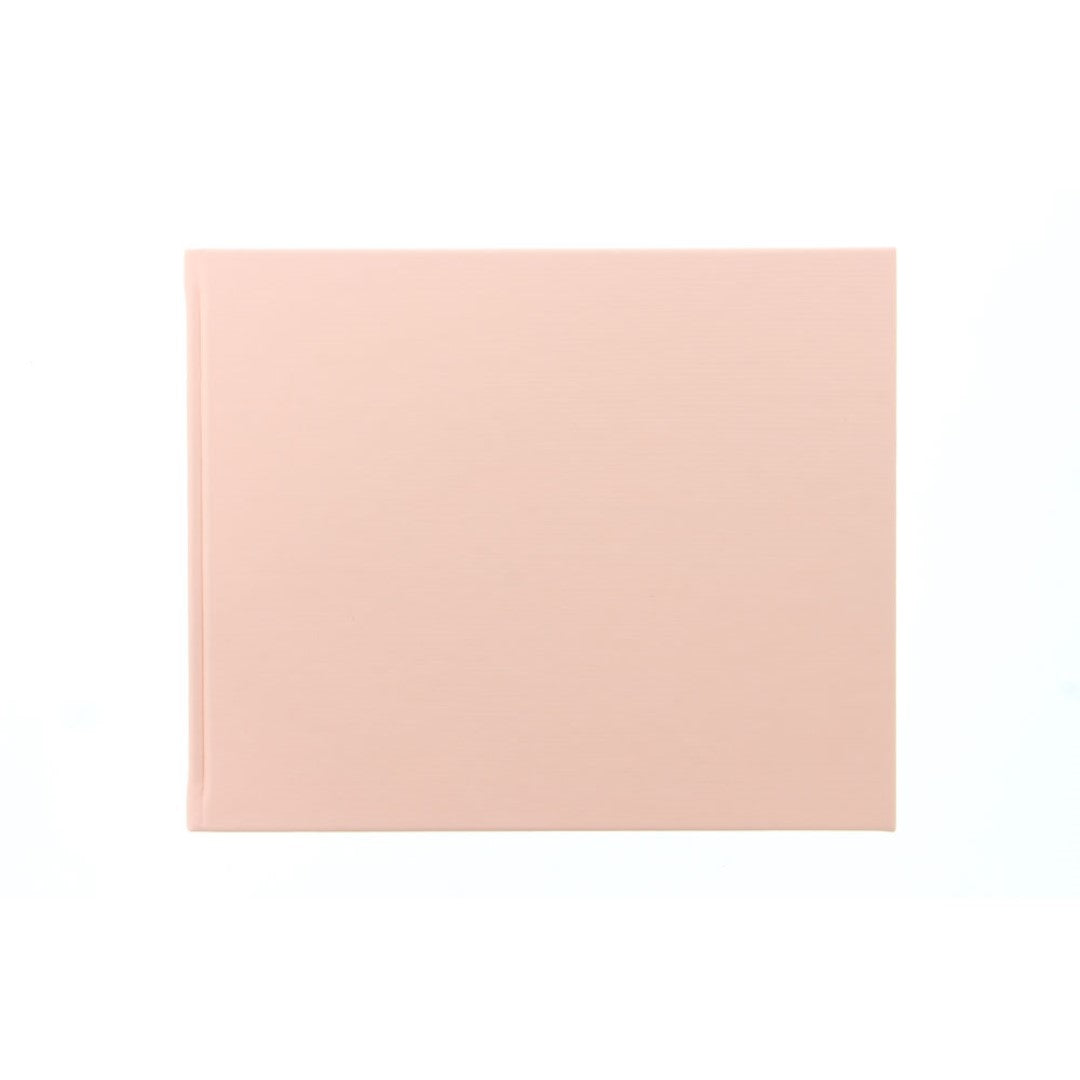 Elegant pastel peach guest book with 128 ruled pages, perfect for preserving memories and guest messages at special events.
