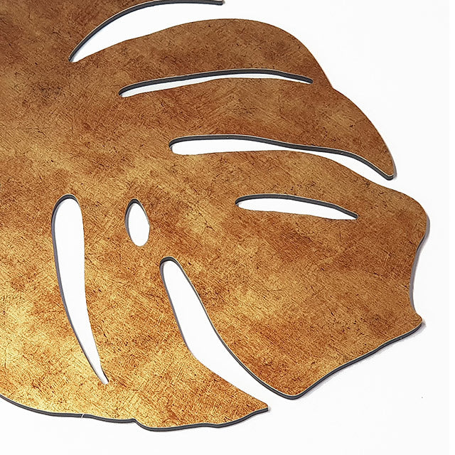 Antique gold textured monstera leaf wall art set, ideal for enhancing indoor and covered outdoor spaces.