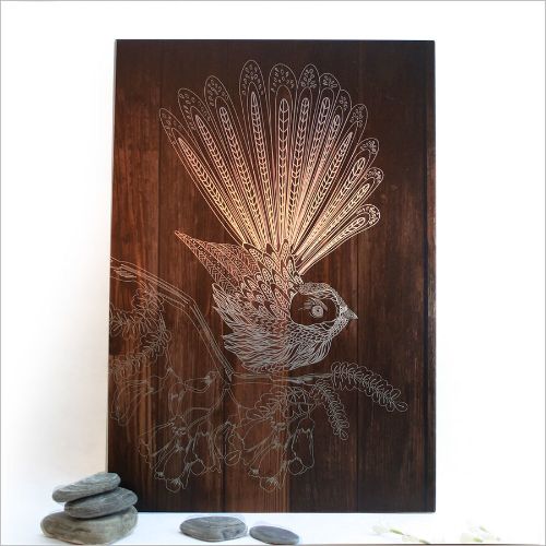 Kiwiana Wall Art featuring a dark wood fantail design on brushed silver, perfect for adding New Zealand charm indoors or outdoors.