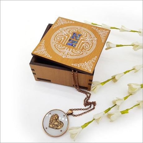 Elegant square trinket box with NZ veneer and paua inlay, perfect for storing jewelry and small treasures.