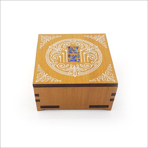 Elegant square trinket box in NZ veneer with vibrant paua inlay, perfect for storing keepsakes and enhancing decor.