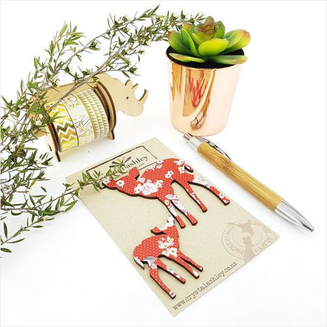 Whimsical Bambi wall art featuring vibrant red floral accents, perfect for children's rooms and playful decor.