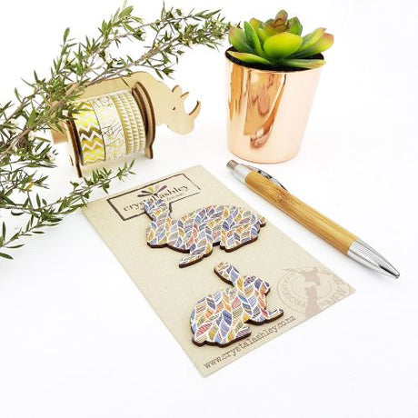 Whimsical wall art featuring bunnies and feather patterns, perfect for nurseries and playful decor.