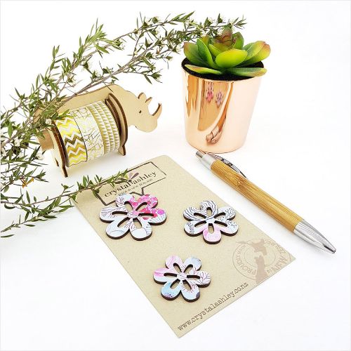 Blue floral wall art featuring daisies in playful mini shapes, perfect for brightening any living space.