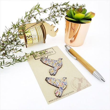 Decorative wall art set featuring mini pigeon-shaped designs with intricate feather patterns, ideal for home decor.