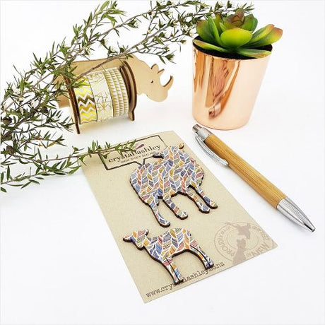 Charming wall art featuring a whimsical sheep family with a feather pattern, perfect for nurseries and playful decor.