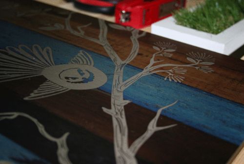Large Kiwiana wall art featuring a fantail bird illustration on rustic aged timber background, perfect for home decor.