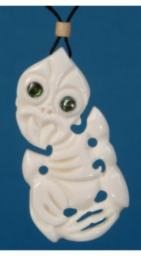 Bone Tiki Pendant featuring natural bone, carved Maori designs, and paua eyes, symbolizing protection and heritage.