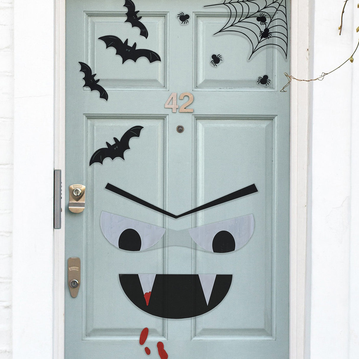 Halloween door stickers featuring a spooky vampire, bats, spiders, and blood drips for festive decorations.
