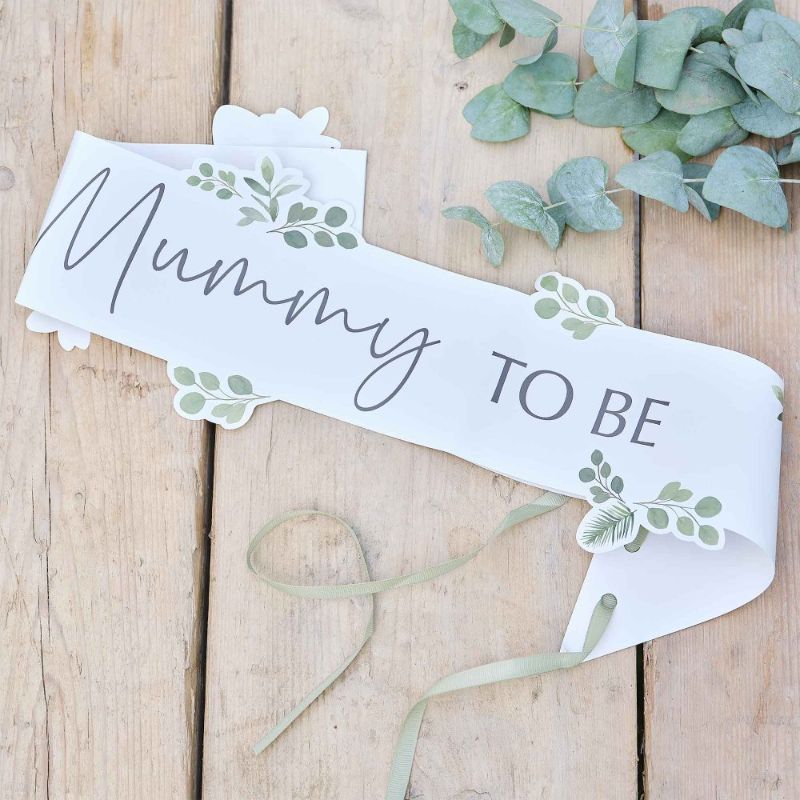 Botanical Baby Mummy to Be sash featuring a beautiful print and sage green ribbon for an elegant baby shower accessory.