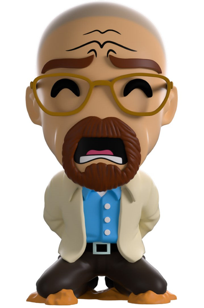 Collectible Youtooz figure of Walt from Breaking Bad, kneeling with cuffed hands, detailed with glasses and desert terrain.