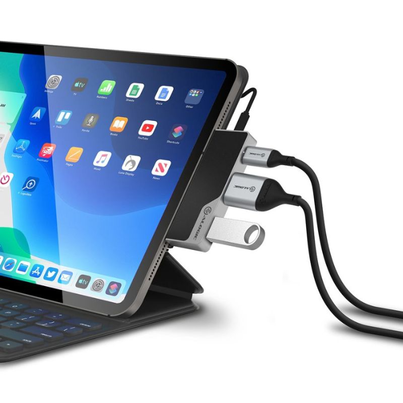 Alogic USB-C Mini Dock with HDMI/USB-A, compact design, 4K video support, 60W Power Delivery, suitable for laptops and tablets.