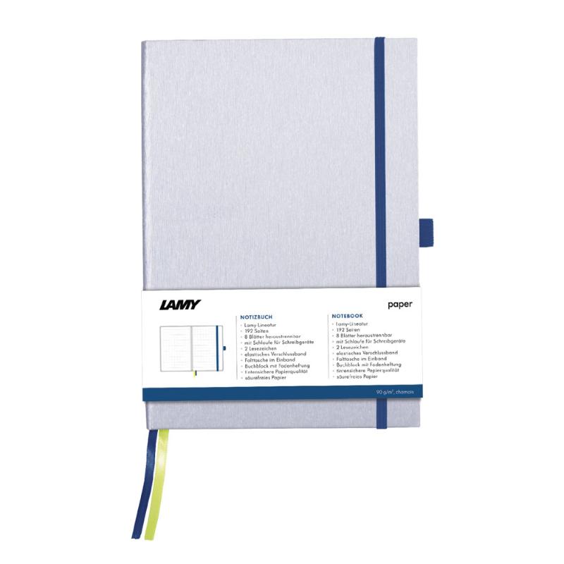 Lamy A5 Notebook with silver hard cover and ocean blue edges, featuring 192 bleedproof pages and stylish organization accessories.