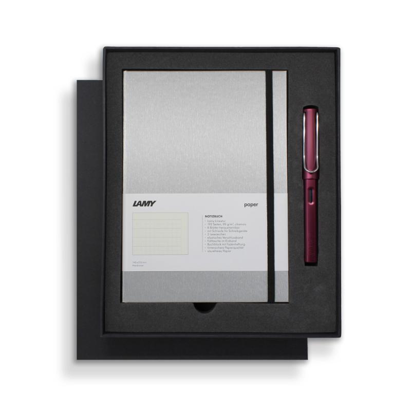 Lamy Notebook Fountain Pen Gift Set featuring a sleek black and purple design with a fountain pen and stylish A5 notebook.