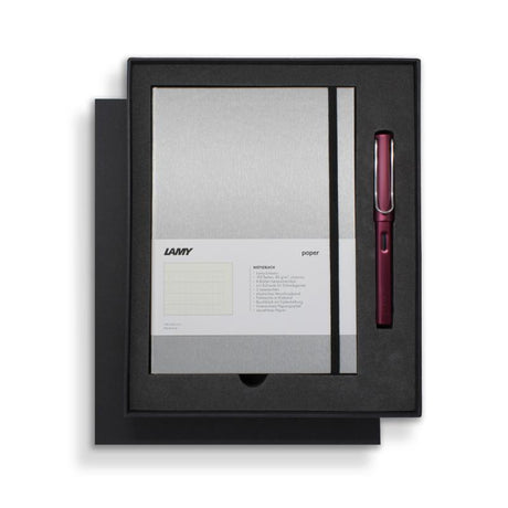 Lamy Notebook Fountain Pen Gift Set featuring a sleek black and purple design with a fountain pen and stylish A5 notebook.
