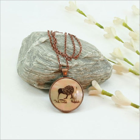 Circle Pendant Necklace featuring a kiwi design on mother of pearl, elegant filigree pattern, 75cm chain, 30mm diameter pendant.