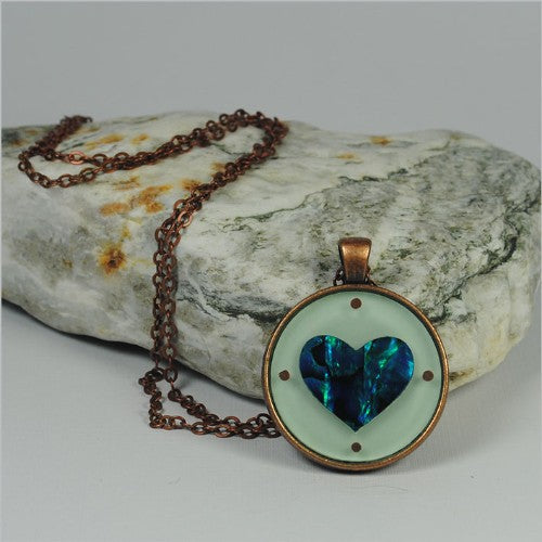 Circle Pendant Necklace featuring a vibrant Paua heart in green, crafted from authentic South Island shell with a 75cm chain.