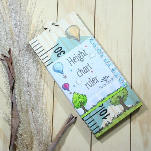 Whimsical space-themed growth chart ruler for tracking children's height while enhancing room decor.