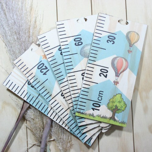 Whimsical space-themed growth chart ruler, perfect for tracking children's height and creating lasting memories.