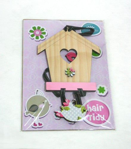 Charming Birdhouse hairclip organizer in pink and pine, perfect for stylishly storing hair accessories.