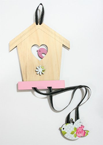 Charming birdhouse-shaped hair accessory organizer made of pine and pink rose MDF for stylish storage and easy access.