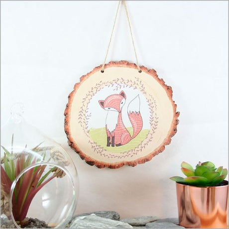 Whimsical Mr. Fox illustration on wood slice wall art, perfect for adding rustic charm to any room.